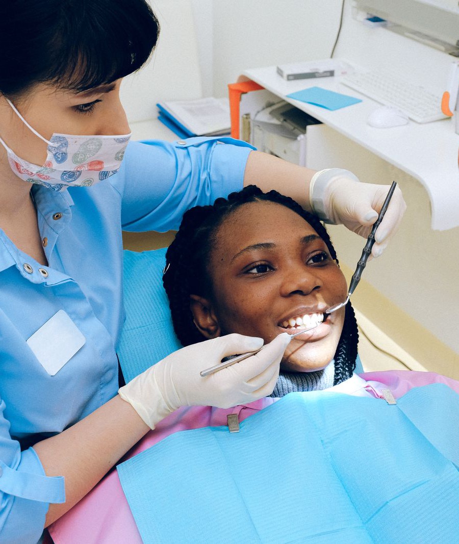 Dentist examining a patient in a dental chair