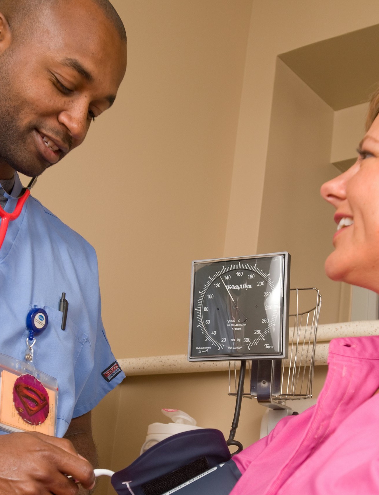 Clinician checking a patient's blood pressure during an urgent care visit